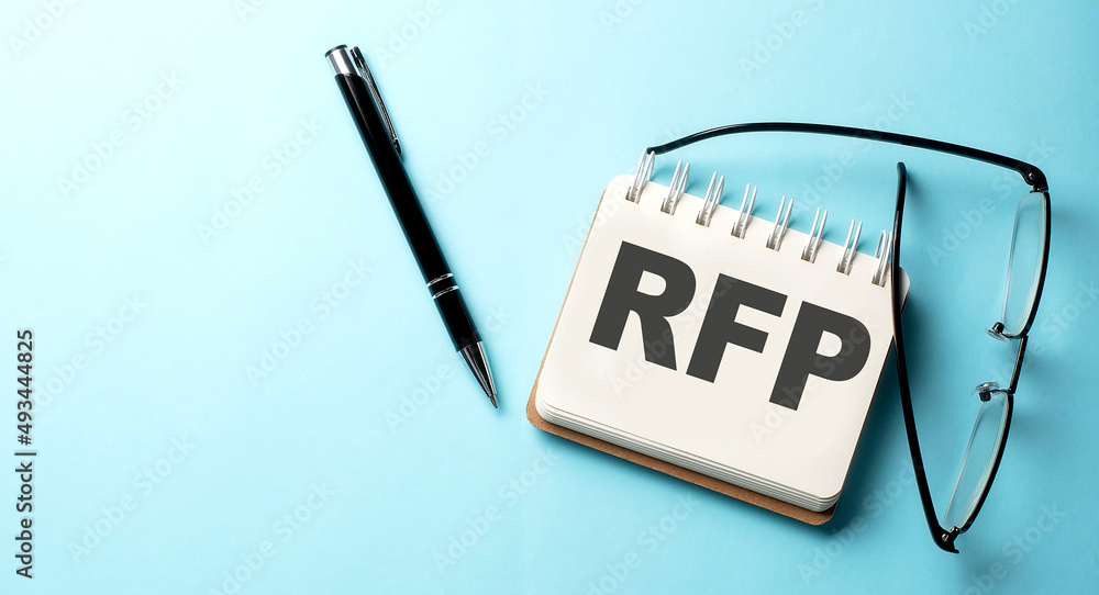 Poster rfp text written on a notepad on the blue background