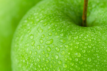 Drops on a green apple, macro