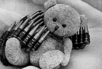 rustic style teddy bear on hessian and rough fabric with war time toys, illustrating a childhood...