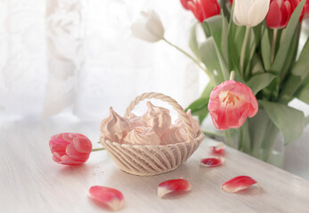 Spring still life with marshmallows and tulips