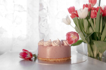 Spring still life with cake and tulips