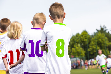 Children in Colourful Sports Jersey Uniforms. Friends on a Soccer Team Standing United in a Line. Boys in School Sports Team