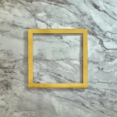 Simple gold frame on a gray-white marble background. Text space. Top view. Minimal style.