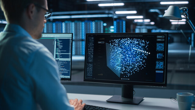 Technical Operator Works at His Workstation with Display Showing Neural Network In the System Control Room. IT Technician Works on Artificial Intelligence, Big Data Research Facility