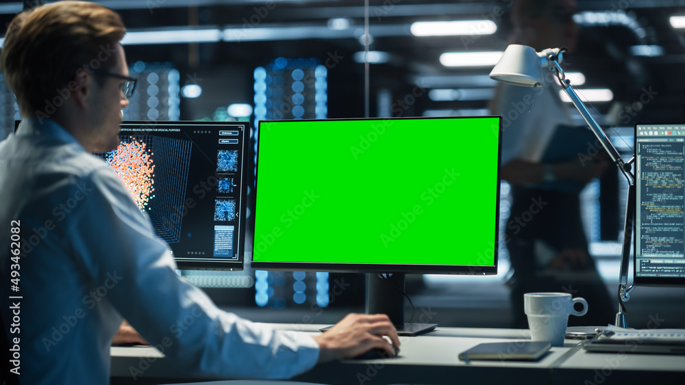 Poster Confident Female Data Scientist Works on Personal Computer in Big Infrastructure Control and Monitoring Room. Caucasian Engineer in the Evening Office. IT Technician Works on Artificial Intelligence