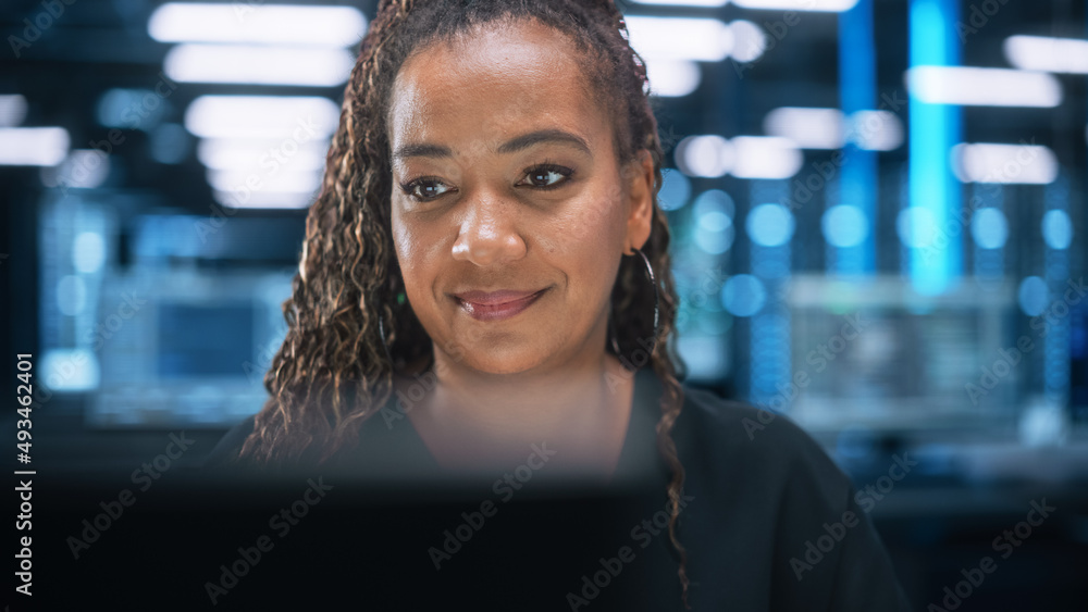 Poster Portrait of Multiracial Female IT Developer Working on Desktop in Data Center. System Administrator Works on Web Services, Cloud Computing, Server Analytics, Cyber Security Maintenance Concept