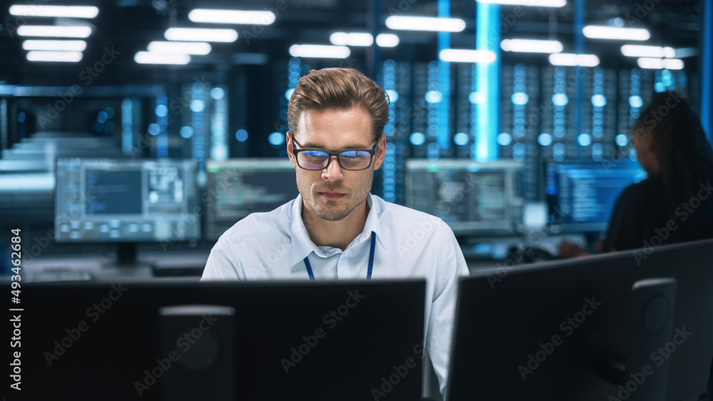 Poster Night Office: Young Caucasian Man Working on Two Desktop Computers. Digital Entrepreneur Typing Code, Creating Modern Software, e-Commerce App Design, e-Business Programming