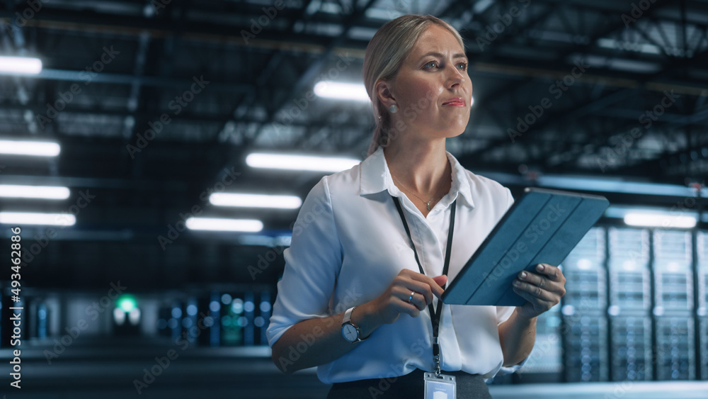 Aufkleber young caucasian female employee uses tablet computer in system control monitoring center at night. e