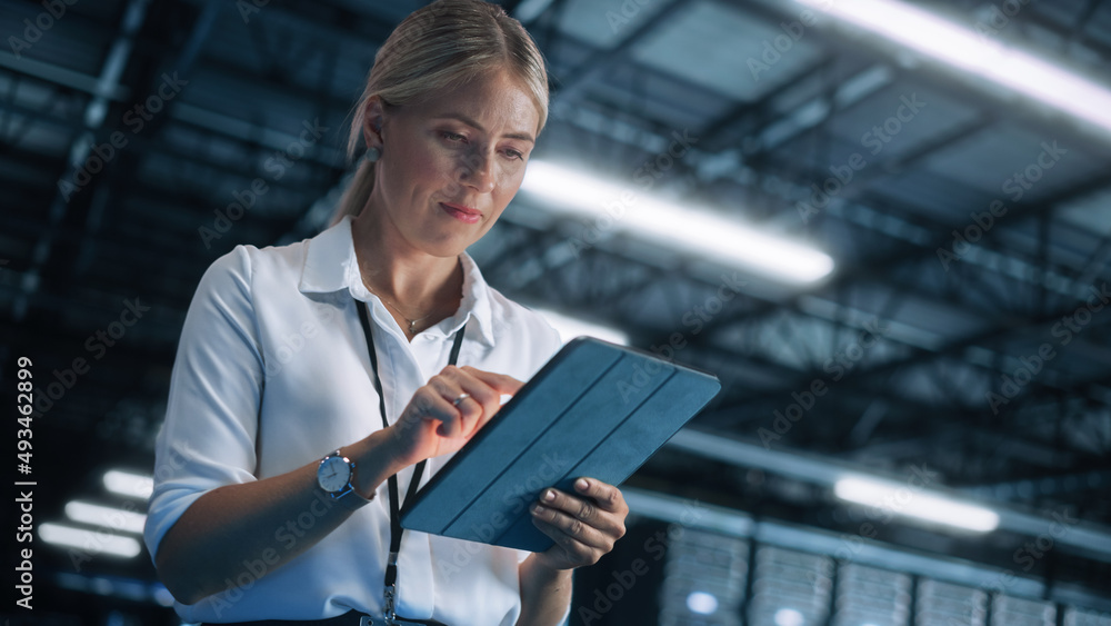 Poster female it specialist using digital tablet computer in massive data center facility. big data, cybers