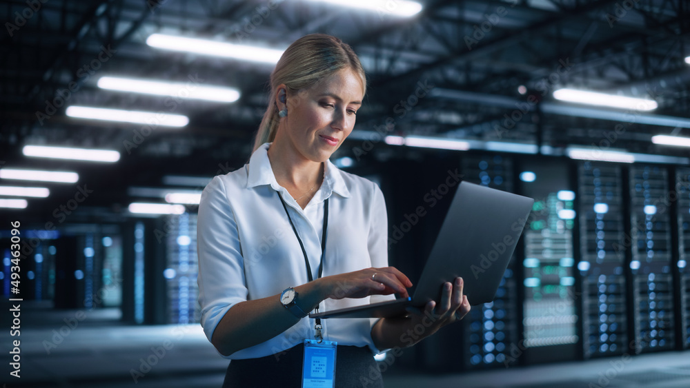 Aufkleber Female Engineer Holding Laptop Computer at Hands while Programs Something. She Works in Modern High-Tech Office. High-Speed Data Transfer and Smooth Server Operation, Analytics, Statistics Concept