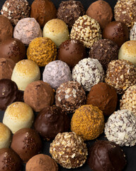chocolate truffles on black background