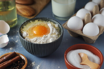 Food ingredients for baking: flour, eggs, milk, sugar