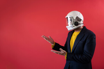 Businessman in astronaut helmet looking to the side.