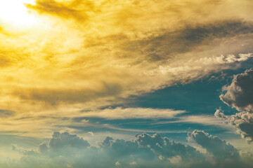Dramatic clouds and sky like heaven view at sunset time. with gold or golden light tone. with blue sky.