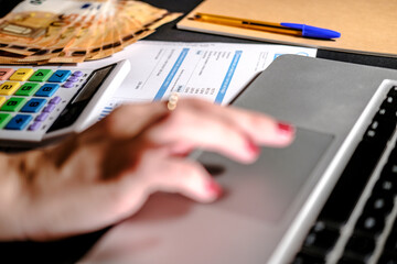 Close up view of a electricity utility bill that is checked