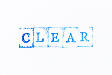 Blue color ink rubber stamp in word clear on white paper background
