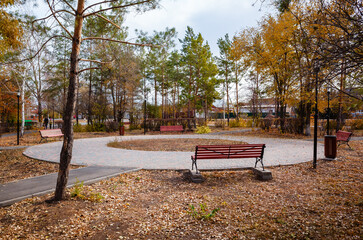 Benches in the autumn park. Russia, Orenburg city, Kargala settlement