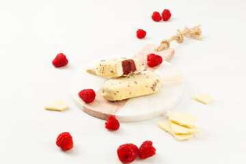popsicles and chocolate chips on a white background