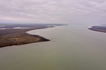 steppe plain landscape lake in the middle of fields