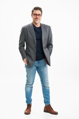Middle age businessman in business casual. Entrepreneur in jeans and jacket. Mid adult, mature age man, happy smiling. Full length portrait isolated on white.