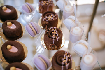 Delicious cakes on the dessert table in a restaurant at a holiday party