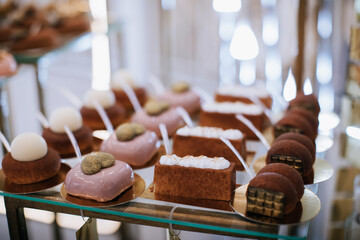 Delicious cakes on the dessert table in a restaurant at a holiday party
