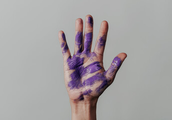 hand with stains of purple paint
