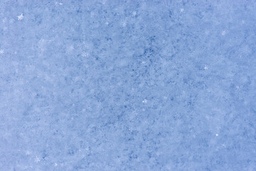 Fototapeta na wymiar blue snow texture close-up. Snow background