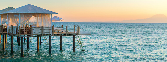 Love rendezvous in a house in the water. A gazebo for relaxing and sunbathing on the sea. Extra wide format