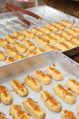 The golden yellow Kaasstengels cookies (Dutch cheese finger cookies) fresh from the oven