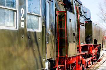 Old steam locomotive close up.