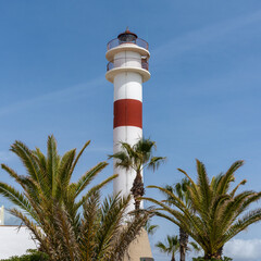 view of the historic lighthouse in the old city center of Rota