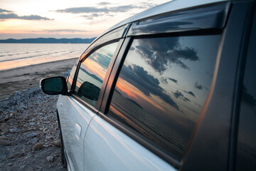 Twilight sky reflect on mirror car door for journey concept