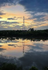 power lines and reflection in the lotus pond