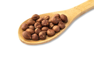Hazelnuts in a spoon isolated over white background