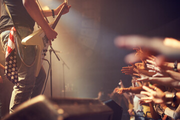 I love rock and roll. A talented guitarist rocking out on stage.
