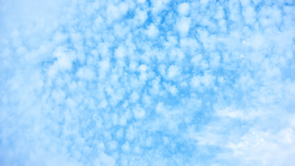 Fototapeta na wymiar Blue sky with many small clouds