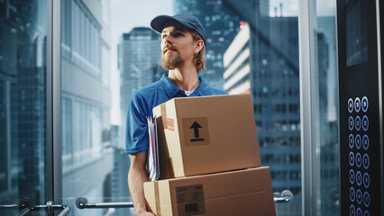 Young Delivery Person Riding Glass Elevator in Modern Office Building. Mail Courier Holding...