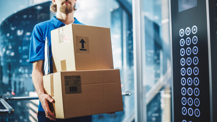 Young Delivery Person Riding Glass Elevator in Modern Office Building. Mail Courier Holding...