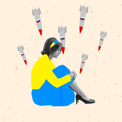 Conceptual image. Young woman wearing blue and yellow ukraininan flag cloth sitting under falling...