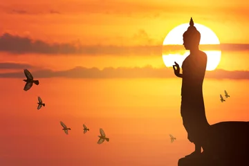 Foto op Plexiglas Buddha images, Big buddha statue on sunset sky © chaophrayaart