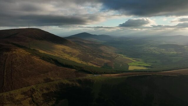 Mount Leinster, Carlow, Ireland, March 2022. Drone pulls backward while ascending and facing southeast towards the summit with Kiltealy and Enniscorthy Wexford in the distance.