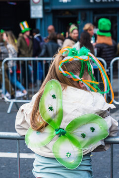 Back of a girl trying to see the Parade, Saint Patrick's day parade in Dublin