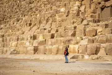 Foto op Canvas Woman at the base of the Cheops, Giza, Cairo, Egypt © angel