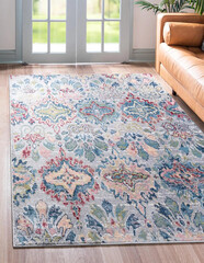 Patterned carpet at living room interior design with sofa against white wall.