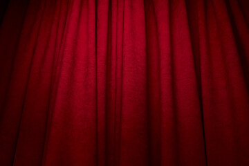 red curtain. Theatrical red curtain with spotlights. A red theater curtain. Background or establishing shot. Front view. red curtain fade to dark.