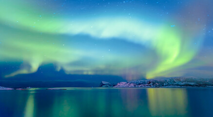 Northern lights or Aurora borealis in the sky over Tromso, Norway - Powered by Adobe