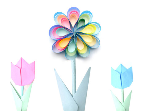 Origami flowers on white