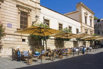Fototapeta na wymiar Street cafe in Old Town in Syracuse, Sicily, Italy