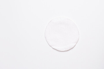 Cotton pad lies on a white background